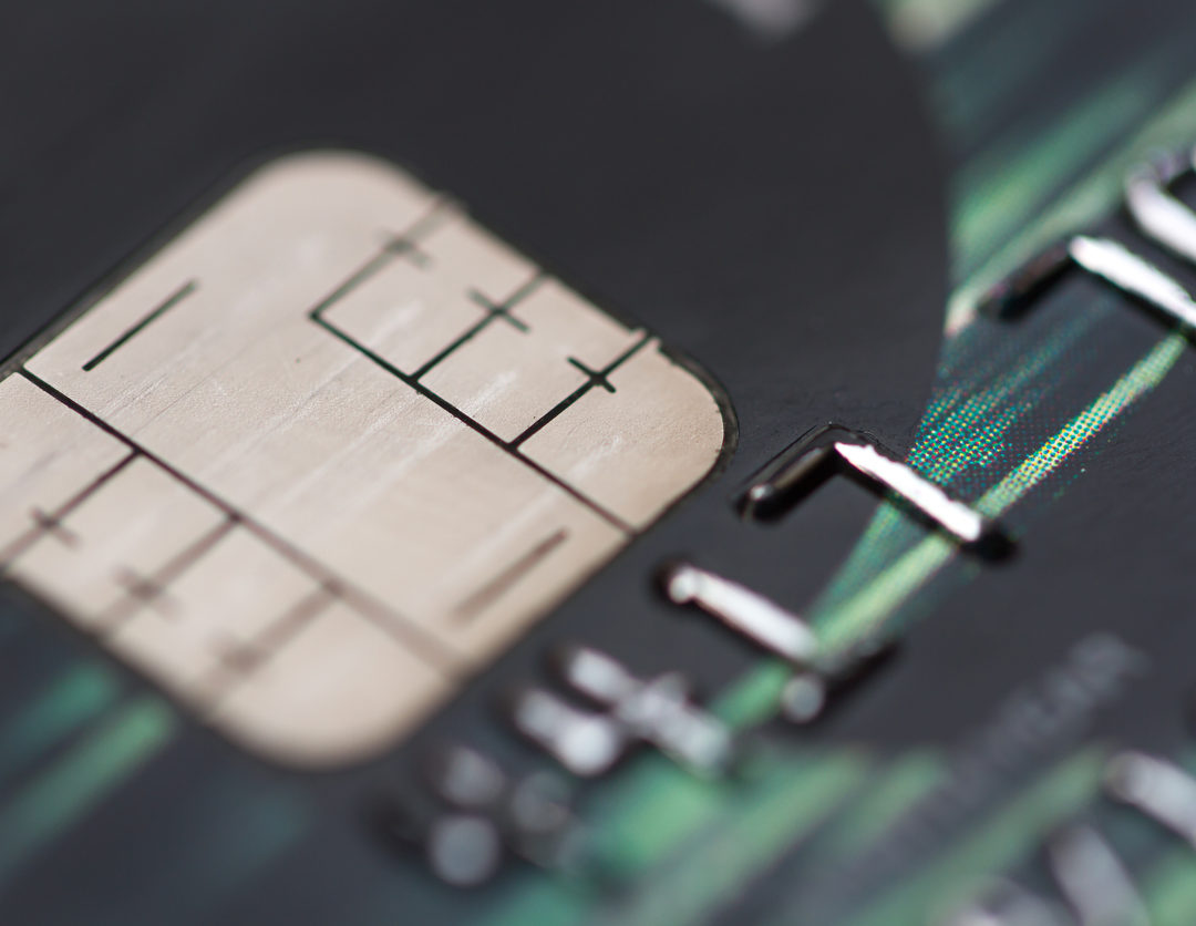 A credit card chip above its numbers